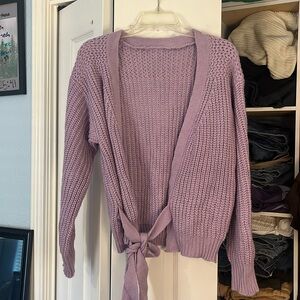 A small/medium-sized purple sweater.